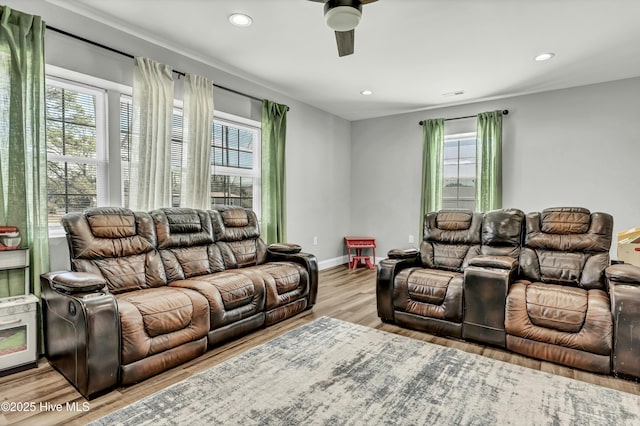 living room featuring recessed lighting, baseboards, wood finished floors, and ceiling fan