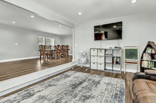 living room with recessed lighting, wood finished floors, and baseboards