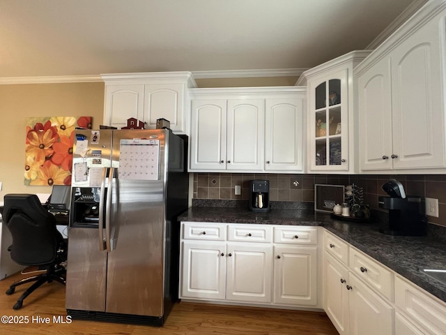6725 Hemlock Ct, Sims, NC 27880 - kitchen featuring stainless steel fridge, crown molding, and white cabinetry
