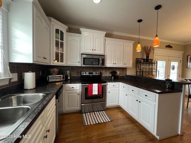6725 Hemlock Ct, Sims, NC 27880 - kitchen featuring a peninsula, dark countertops, stainless steel appliances, and a sink