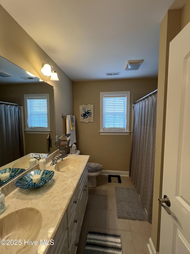 6725 Hemlock Ct, Sims, NC 27880 - bathroom featuring double vanity, tile patterned floors, baseboards, and a sink