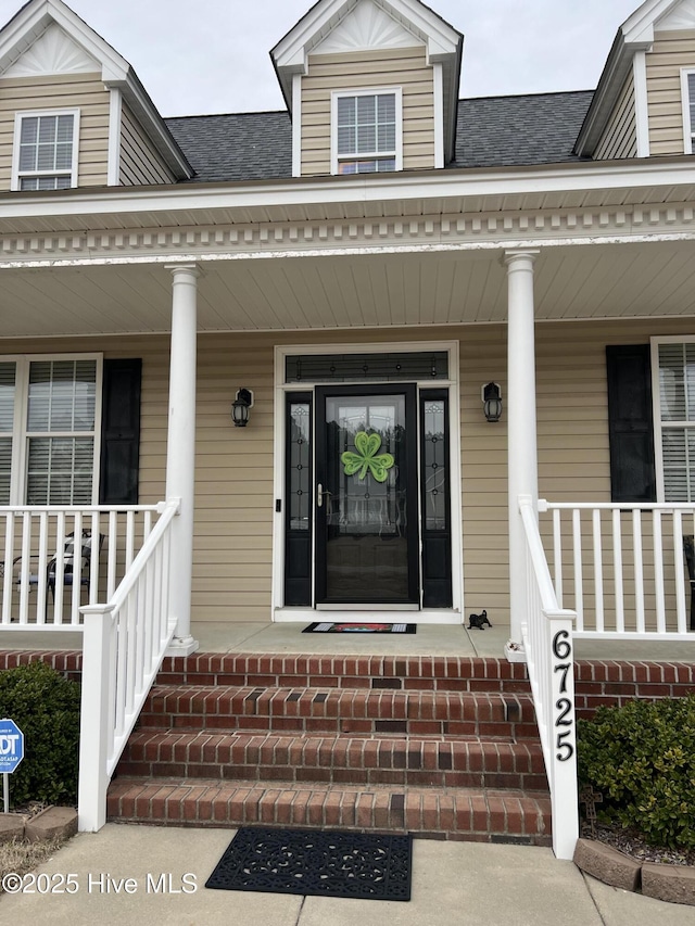 6725 Hemlock Ct, Sims, NC 27880 - property entrance featuring covered porch and roof with shingles