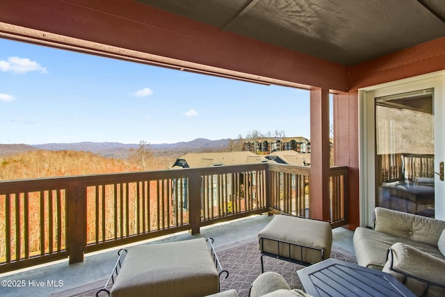 balcony featuring a mountain view