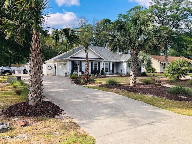 ranch-style house with driveway and an attached garage