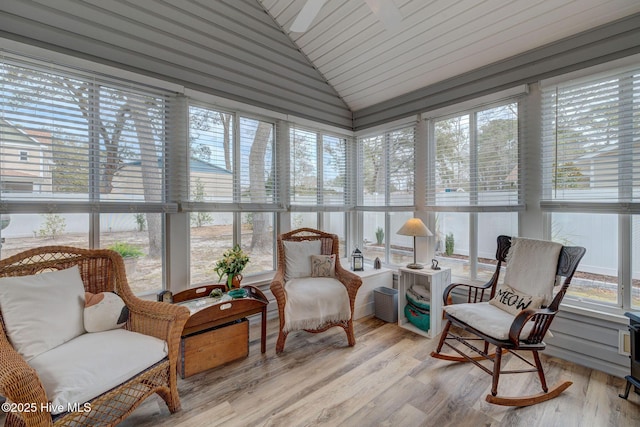 sunroom / solarium with vaulted ceiling and a ceiling fan