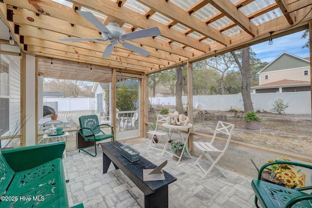 view of patio featuring outdoor dining area, a fenced backyard, a ceiling fan, and a pergola