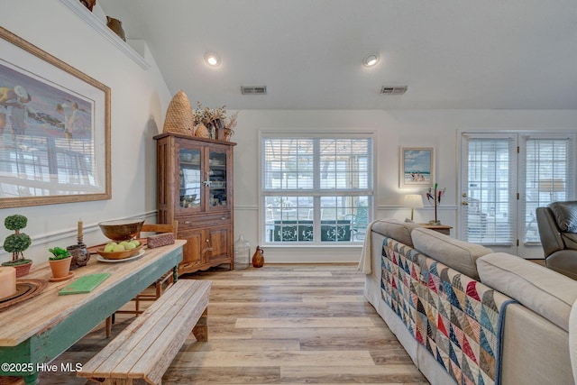 dining space featuring recessed lighting, visible vents, light wood-style flooring, and vaulted ceiling