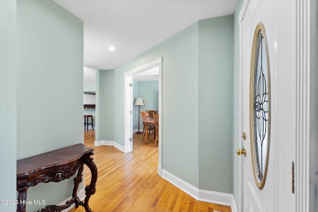 entrance foyer featuring light wood-style flooring, recessed lighting, and baseboards