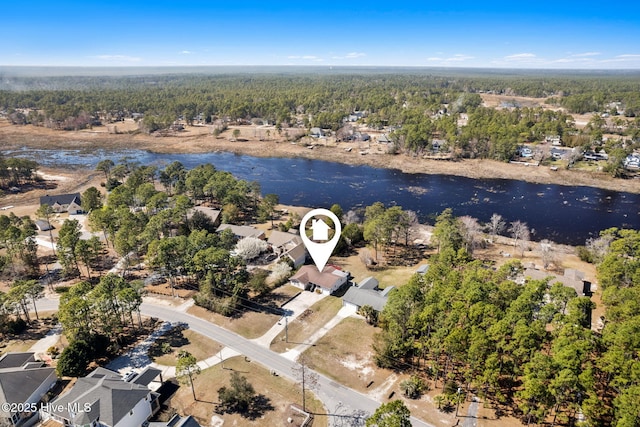 bird's eye view with a forest view and a water view