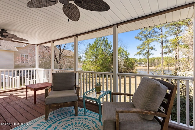 wooden terrace with a ceiling fan