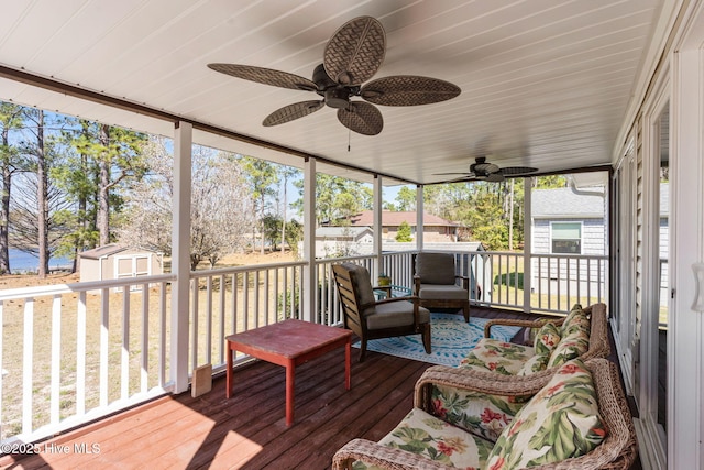 sunroom / solarium featuring ceiling fan