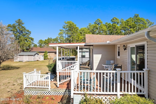 deck featuring a lawn