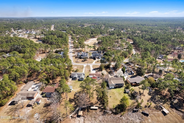 aerial view with a forest view and a residential view