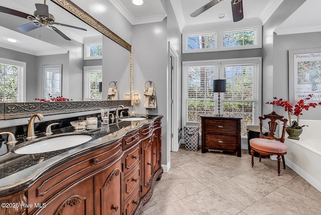 bathroom with a sink, a wealth of natural light, and crown molding