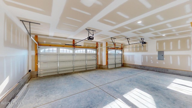 garage with electric panel and a garage door opener