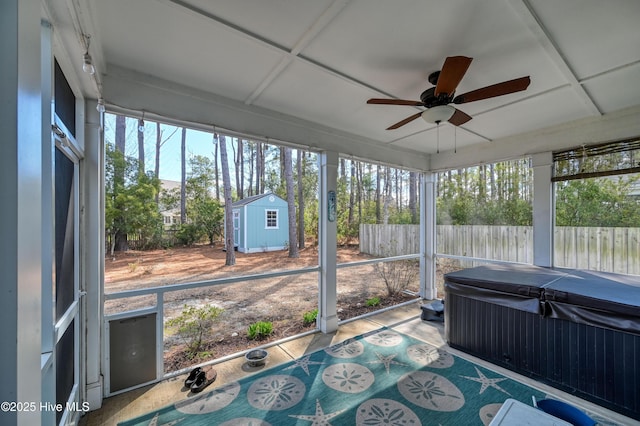 sunroom / solarium featuring ceiling fan