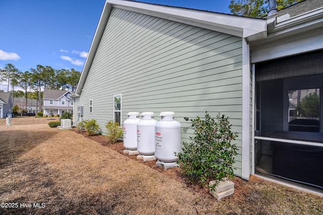 view of side of home featuring central air condition unit