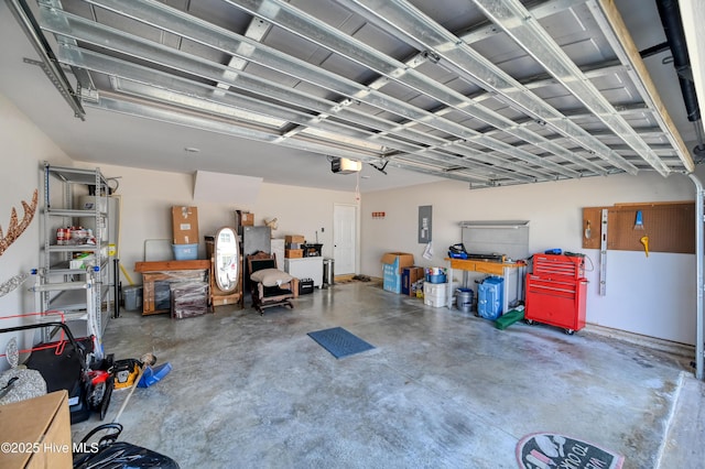 garage with electric panel and a garage door opener