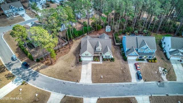 birds eye view of property with a residential view