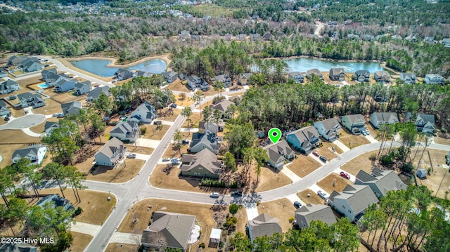 bird's eye view featuring a residential view and a water view