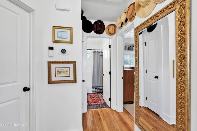 hallway with light wood-style flooring