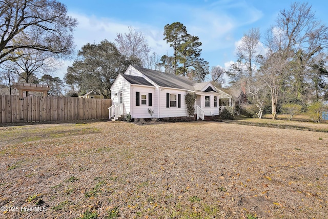 view of front of home with fence