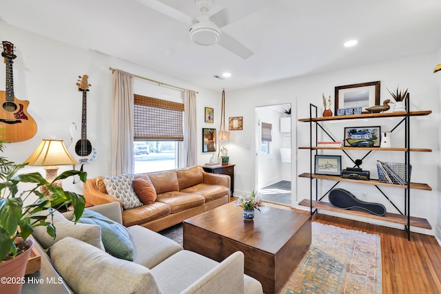 living area featuring recessed lighting, baseboards, a ceiling fan, and wood finished floors