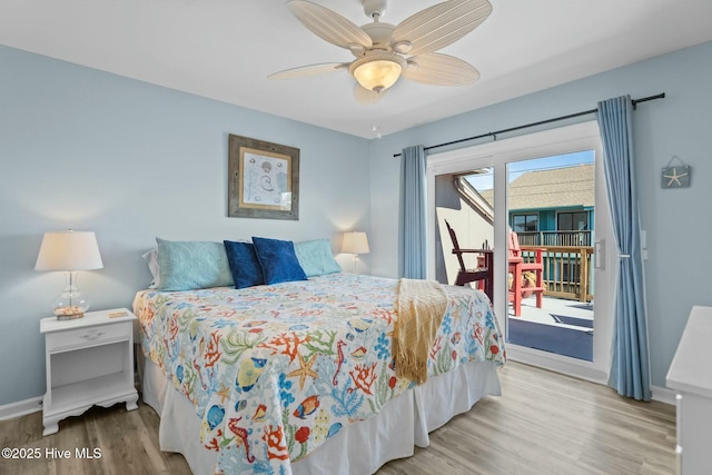 bedroom featuring access to exterior, baseboards, ceiling fan, and wood finished floors