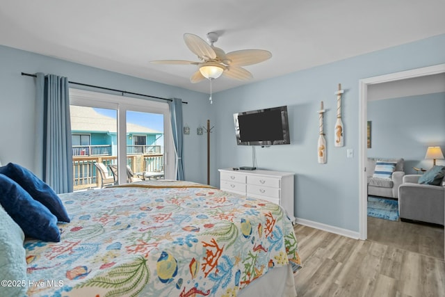 bedroom featuring baseboards, light wood-style floors, ceiling fan, and access to outside