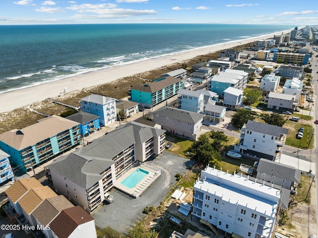 aerial view featuring a view of the beach and a water view