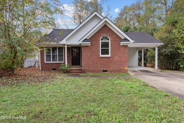 view of front of property featuring roof with shingles, driveway, a front lawn, crawl space, and brick siding