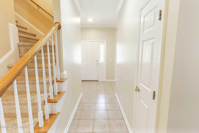 interior space featuring ornamental molding, recessed lighting, stairway, light tile patterned flooring, and baseboards