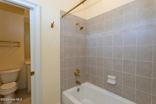 bathroom featuring tile patterned floors, toilet, and washtub / shower combination