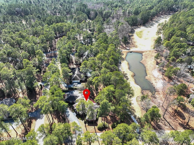 aerial view featuring a water view and a view of trees