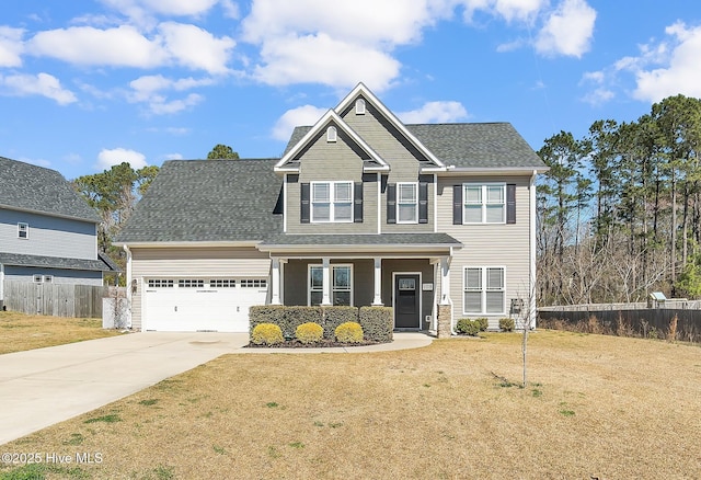 craftsman inspired home with a shingled roof, a front lawn, fence, concrete driveway, and an attached garage