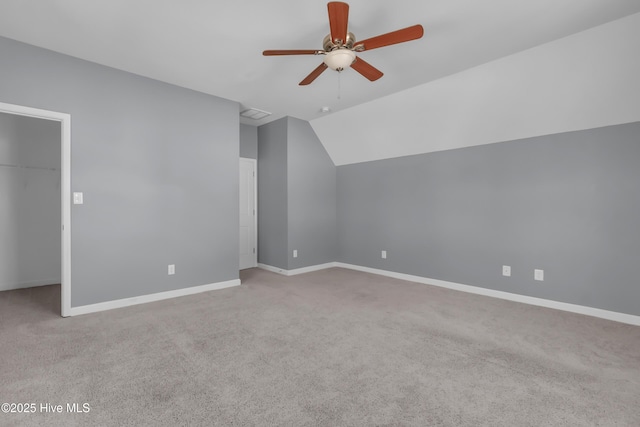 bonus room with vaulted ceiling, baseboards, carpet floors, and ceiling fan