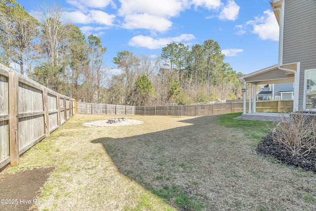 view of yard with a patio and a fenced backyard