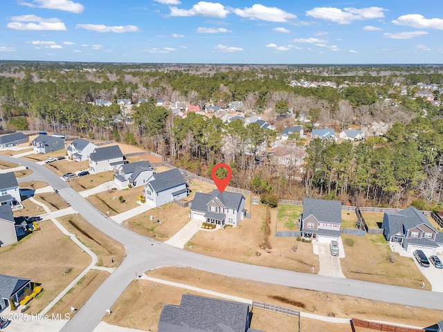 birds eye view of property with a residential view