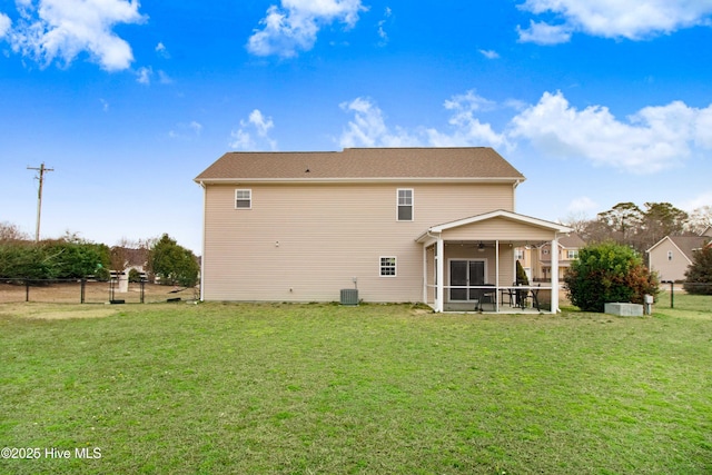 back of property featuring central AC, fence, a yard, and a sunroom