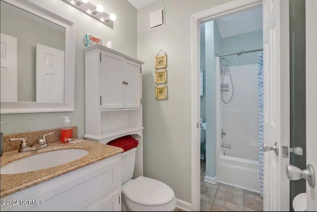 bathroom featuring baseboards, shower / bath combination with curtain, toilet, stone finish floor, and vanity