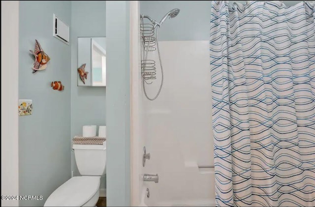 bathroom featuring toilet and shower / bath combo