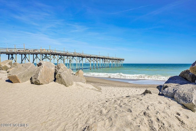 view of water feature with a pier