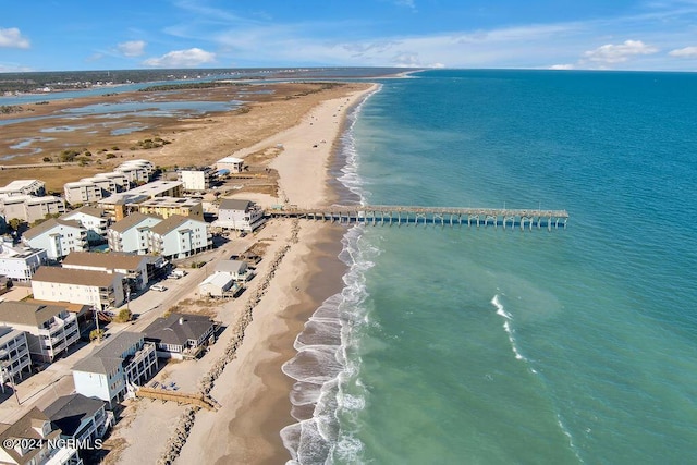 bird's eye view featuring a view of the beach and a water view