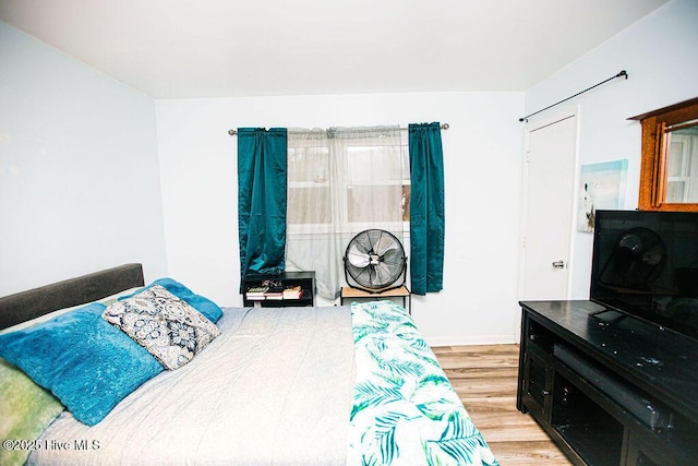 bedroom featuring wood finished floors