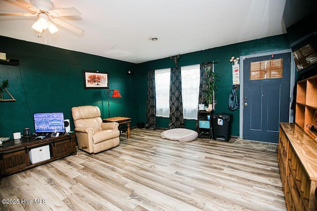 interior space featuring a ceiling fan and wood finished floors