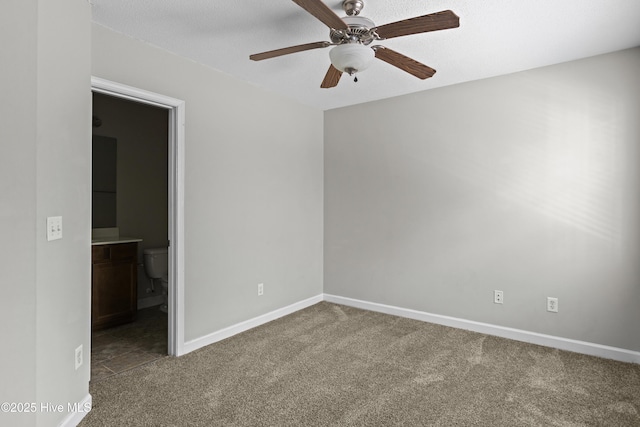 unfurnished room with carpet flooring, baseboards, and ceiling fan