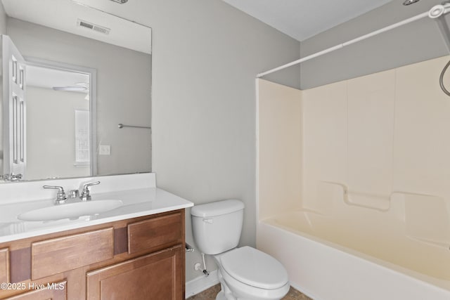 bathroom featuring vanity, bathing tub / shower combination, toilet, and visible vents