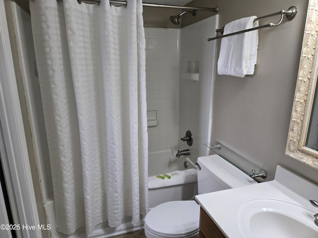 bathroom with toilet, shower / bath combo, and vanity