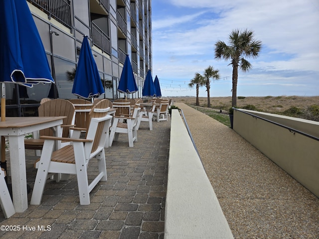 view of property's community with a patio