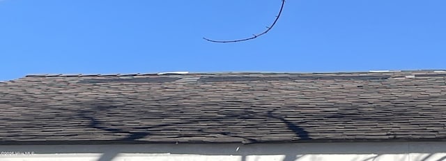 exterior details with a shingled roof